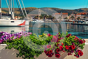 Cityscape with walkway and luxury boats in harbor, Trogir, Croatia
