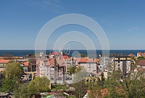 Cityscape of Zelenogradsk with ferris wheel and sea