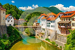 Cityscape of ÃÂ kofja Loka, Slovenia. View of the Capuchin Bridge over the SelÃÂ¡ka Sora River in the old city center photo