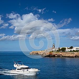 Ciutadella Sa Farola Lighthouse with yatch boat photo