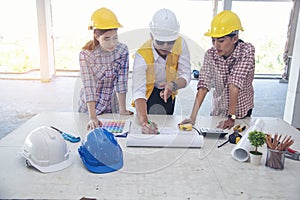 Civil Construction engineer teams shaking hands together wear work helmets worker on construction site. Foreman industry project