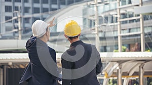 Civil Construction engineer teams shaking hands together wear work helmets worker on construction site. Foreman industry project