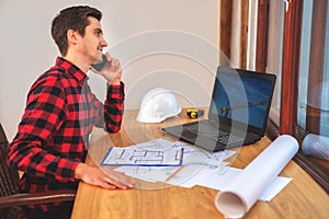 Civil engineer at his Desk working with documents