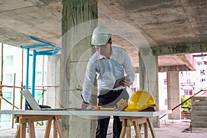 Civil engineer is inspecting in building site