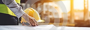 Civil engineer teams working together wear worker helmets hardhat on construction site in modern city. Foreman industry