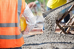 Civil Engineering check a Concrete pouring during commercial concreting floors of building