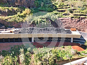 Civil engineering project showing rock shed construction using large quantities of vehicle tyres to form a cushion layer