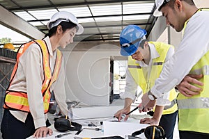 Civil engineering team meets to plan work on construction project in the construction area Foreman, industrial project