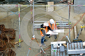 Civil engineers inspecting construction site