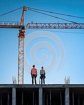Civil engineers supervising the construction of the building