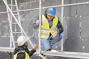 Civil engineers working on construction site