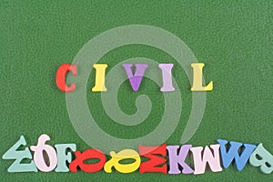 CIVIL word on green background composed from colorful abc alphabet block wooden letters, copy space for ad text. Learning english