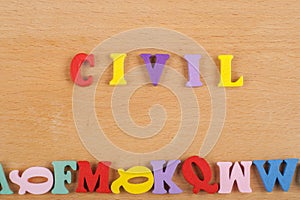 CIVIL word on wooden background composed from colorful abc alphabet block wooden letters, copy space for ad text. Learning english