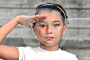 A Civilian Asian Child Girl Saluting