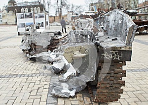 Civilian car shot by Russian soldiers. War in Ukraine. Destroyed russian tank on the Mykhailivs'ka Square.