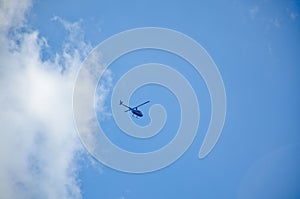 Civilian helicopter blue sky with white cloud