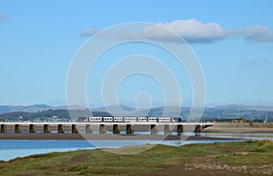 Civity dmu on Arnside viaduct over River Kent