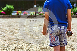 Youth training with tirating or placing boules. photo