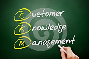 CKM - Customer Knowledge Management acronym, business concept on blackboard