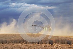 Claas harvester in operation on wheat field