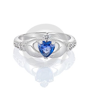 Claddagh ring with blue topaz isolated on white