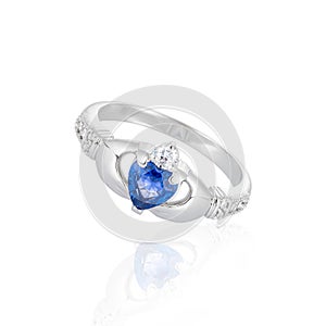 Claddagh ring with blue topaz isolated on white