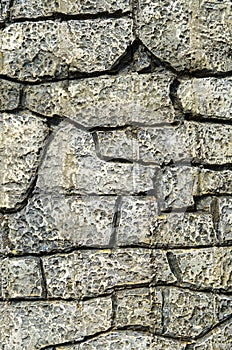 Cladding plates on a wall imitating stone