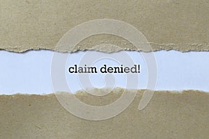 Claim denied word on white paper