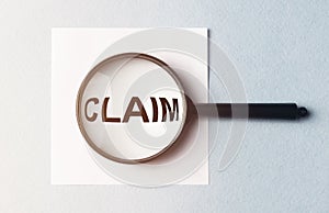 Claim word on paper, lawsuit and claims concept