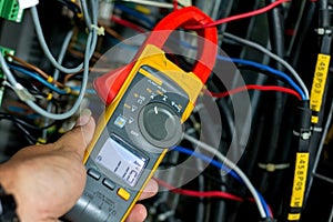 clamp meter to measure an electric current