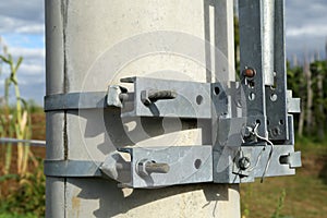 Clamps with fixing bolts on an electric pylon