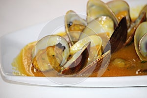 Clams cooked with the recipe clams a la marinera`. A traditional recipe of Spanish gastronomy`