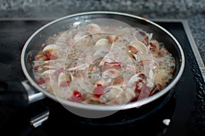 Clams cooking for spaghetti vongole