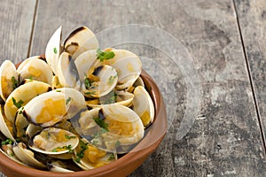 Clams with marinera sauce.Almejas a la marinera. Spanish recipe on wood