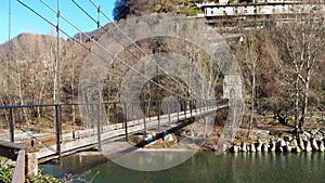 Clanezzo, Bergamo, Italy. The suspension bridge over the Brembo river photo