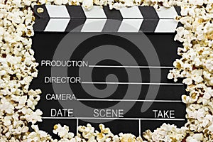 Clapboard with pop corns photo