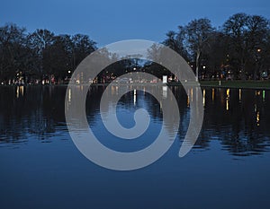 Clapham Common at night; reflection - trees and lights. photo