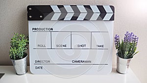 Clapper board or movie slate  for use in video production or film and cinema industry. It`s white color on white background  with