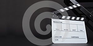 Clapperboard or clap board or movie slate with director chair use in video production ,film, cinema industry on black background