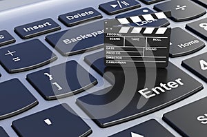 Clapperboard on computer keyboard, 3D rendering