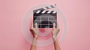 The clapperboard on pink background.AI generated image
