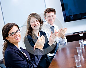 Clapping businesspeople