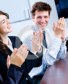 Clapping businesspeople