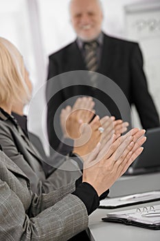 Clapping hands in focus on businessmeeting