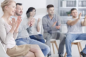 Clapping at support group meeting