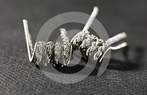 Clapton staged staggered helix coil build for vaping rebuildable atomizer