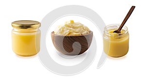 Clarified butter in jar and in wooden bowl, cooking oil, pure ghee isolated on white background.