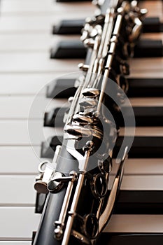 Clarinet lying on piano keys