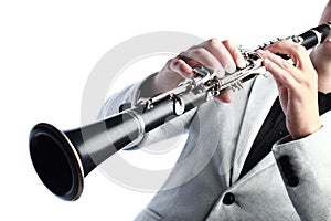 Clarinet player. Clarinetist hands playing woodwind instrument 