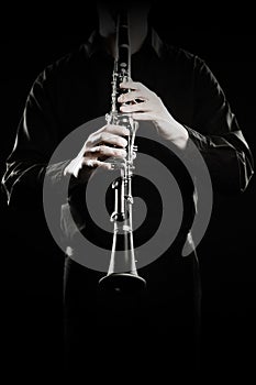 Clarinet player. Clarinetist hands playing woodwind instruments